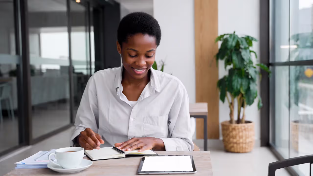 Guest reviewing wellness retreat plans and budget in resort lounge